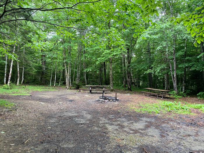 two picnic tables and fire ring