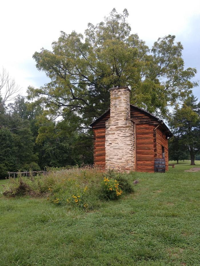 Reconstructed kitchen cabin where Booker T. Washington was bornReconstructed kitchen cabin with herb garden