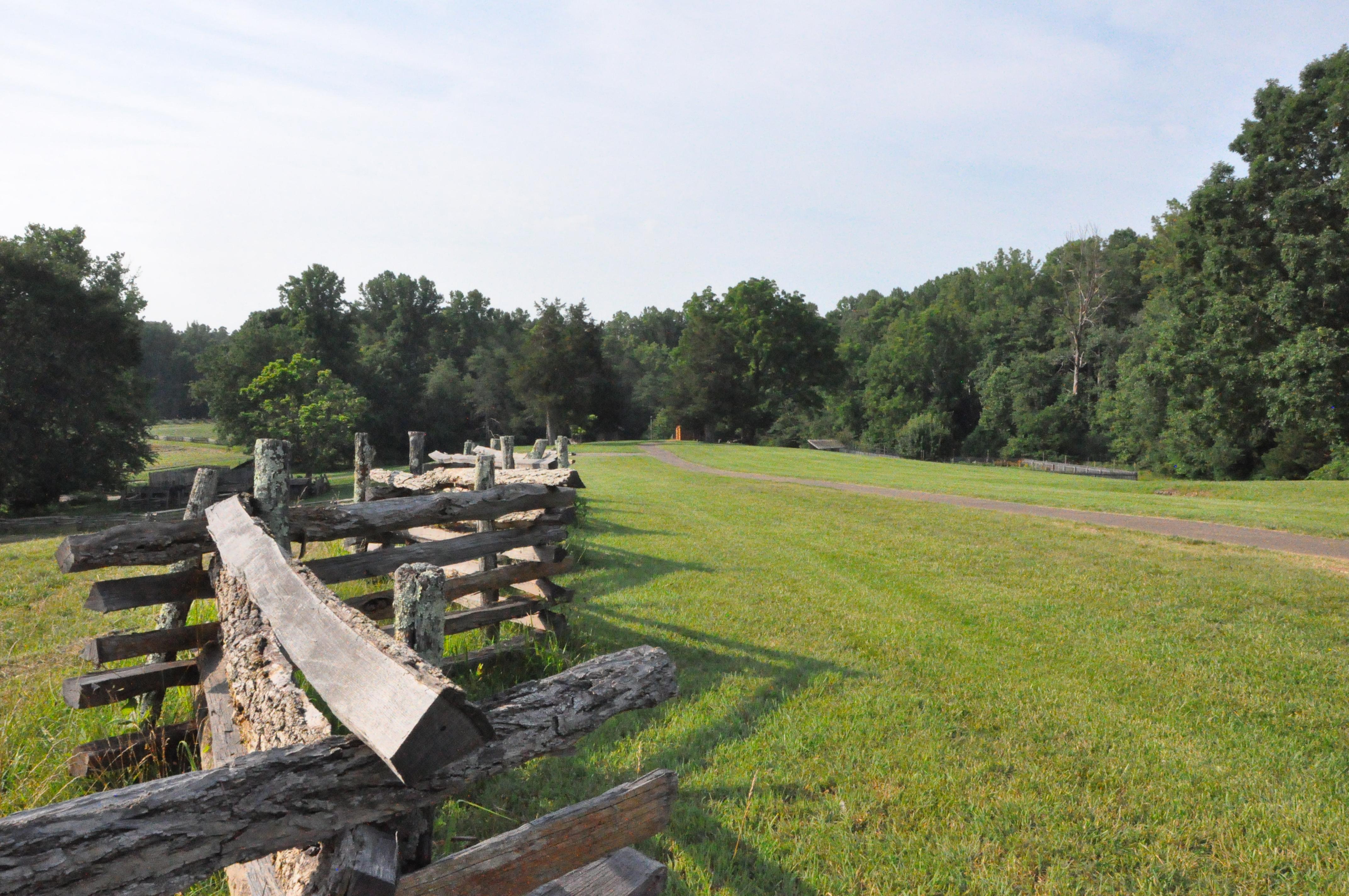 Fence leading down trail from visitor center to historic area