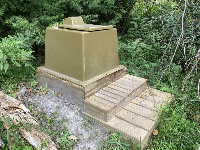 Pit toilet in the woods. No enclosure.