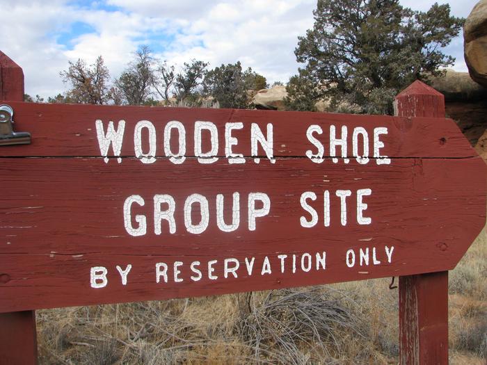 Wooden shoe group site sign.