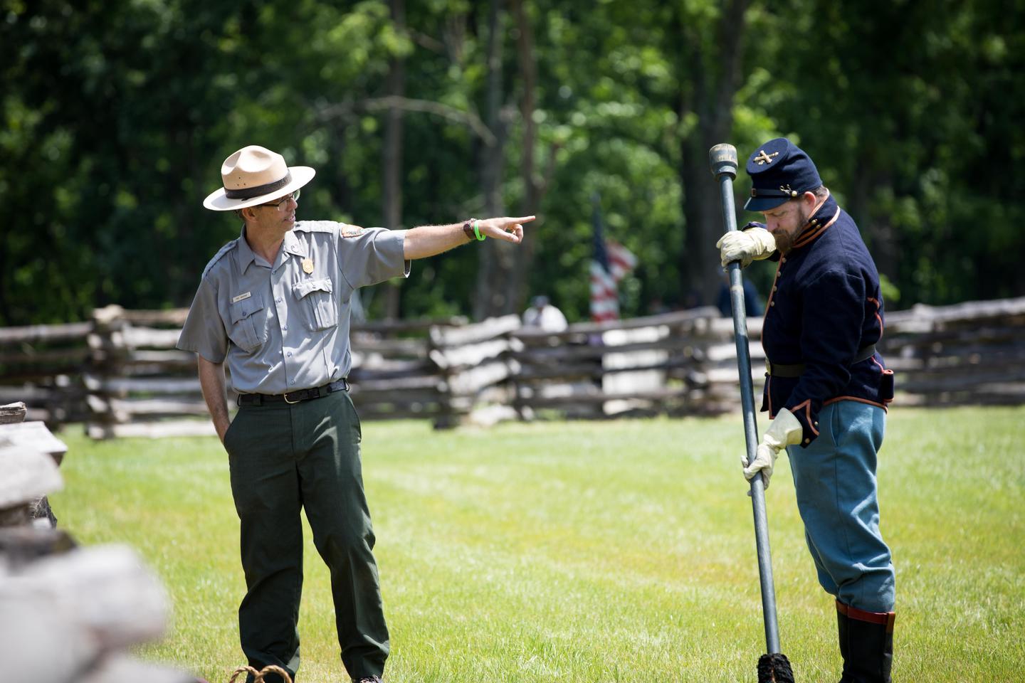 Park Ranger and Cannon CrewRanger Troy Banzhaf giving information about 6 lb. cannon and cannon crew.