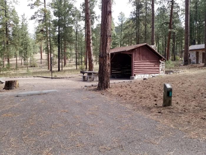 Site 6 provides a shelter with stone fire place, picnic table and metal fire ring.Site 6