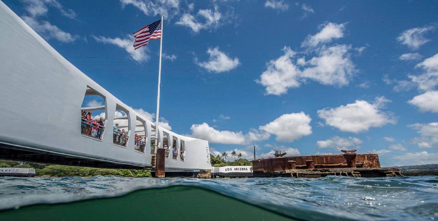 USS Arizona Memorial, viewed from the waterThe USS Arizona Memorial stands over the sunken hulk of the former battleship and today provides a place of reflection and contemplation.