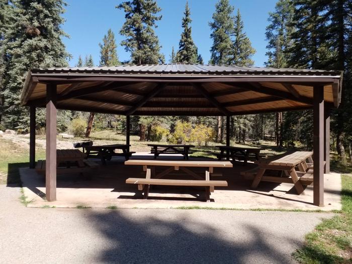 A ramada provieds shade for groups along with picnic tables and a large grill.
Clear Creek Group Campground ramada.