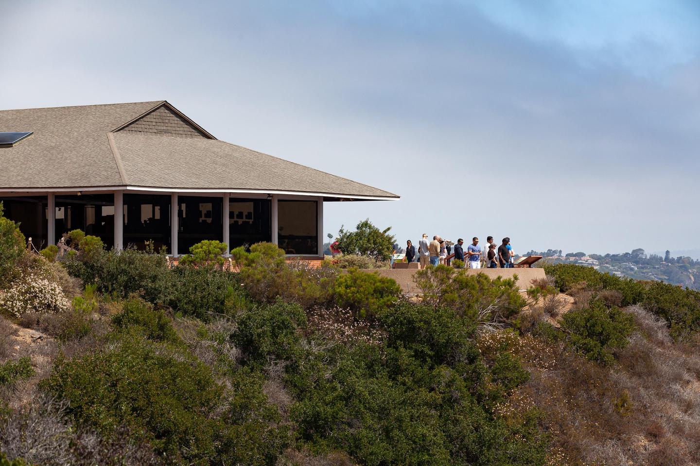 View Building looking to the northThe View Building at the Visitor Center with people at the scenic overlook over San Diego Bay.