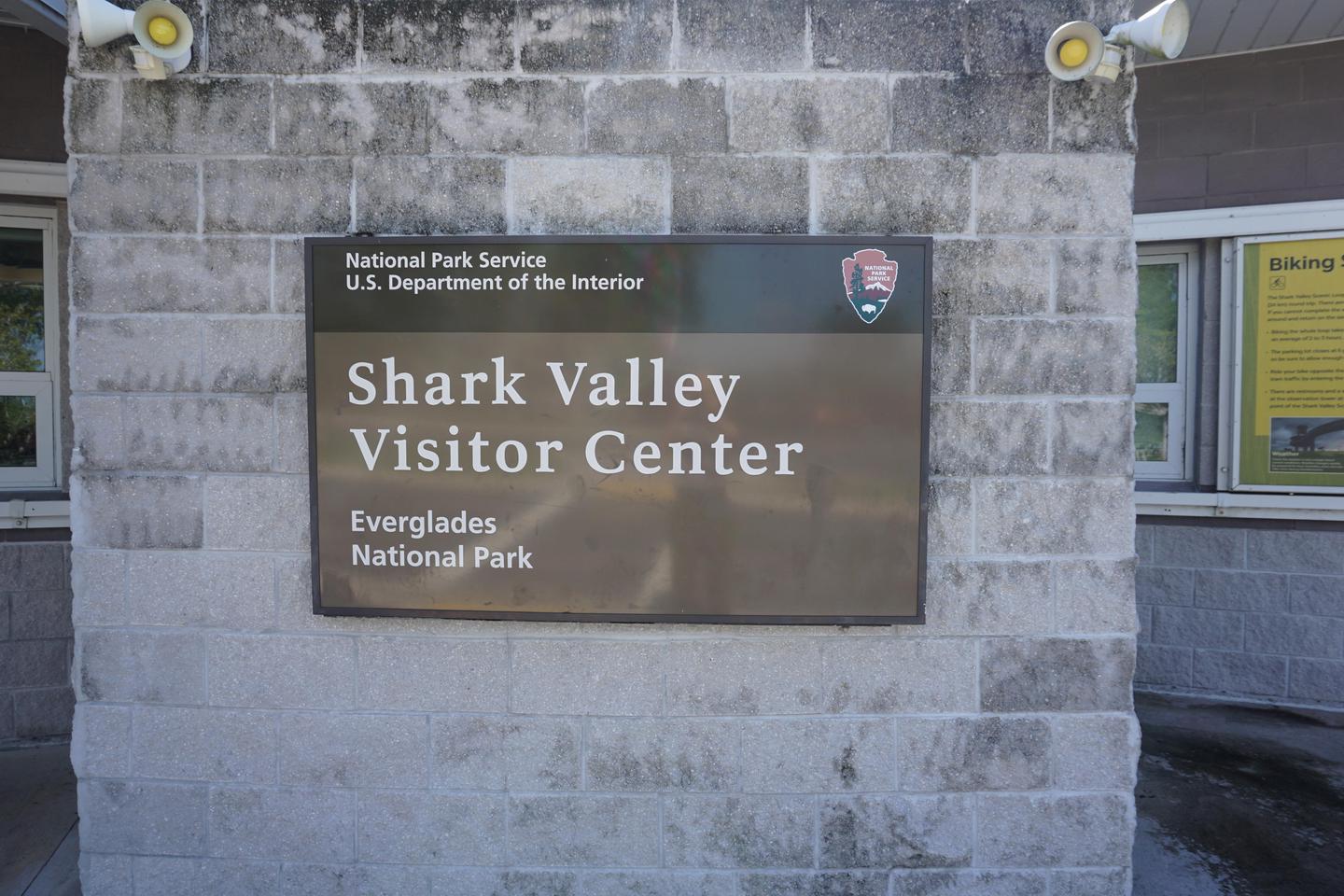 Shark Valley Visitor Center SignSign hanging outside of the Shark Valley Visitor Center