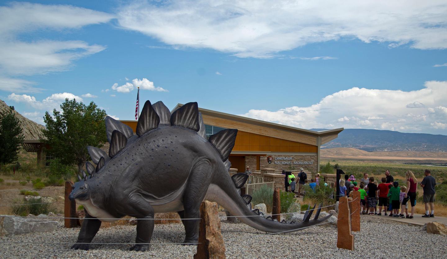 Quarry Visitor Center EntranceA stegosaurus statue from the Worlds Fair stands near the entrance walk to the to the visitor center.
