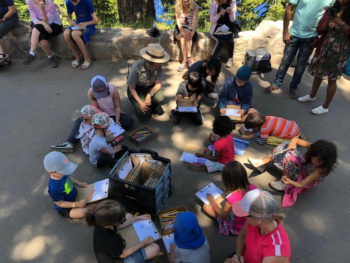 Junior Ranger Postcard ActivityA Junior Ranger Activity presented during the summer at Rim Visitor Center explores art and its relationship to the park. Children are designing postcards. This and other activities are funded by the Crater Lake Natural History Association.