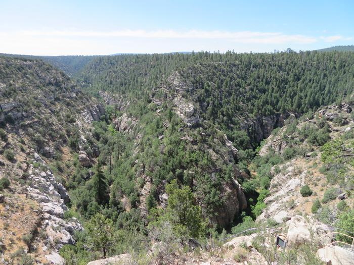 Views of Walnut Canyon from the Visitor Center PatioTake in sweeping views of Walnut Canyon and observe Native American cliff dwellings from a distance on the visitor center's back patio.