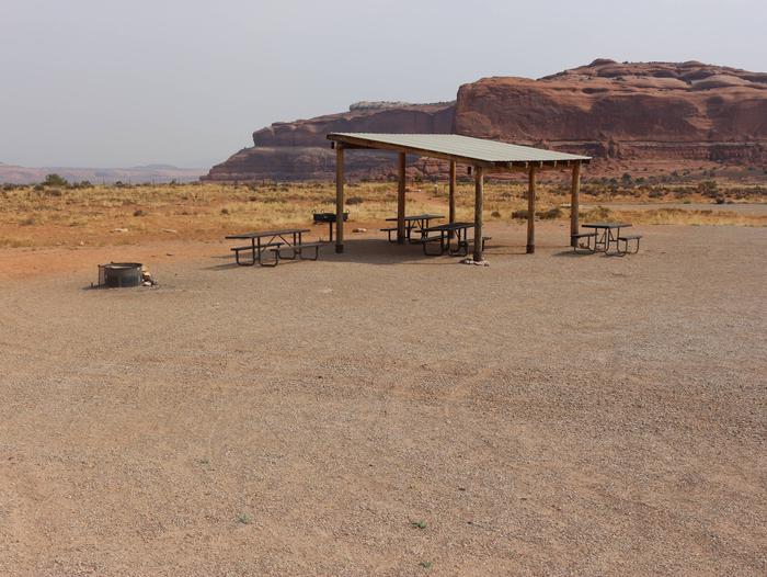 Lone Mesa Group Site C shade shelter, fire ring, and picnic tables. 