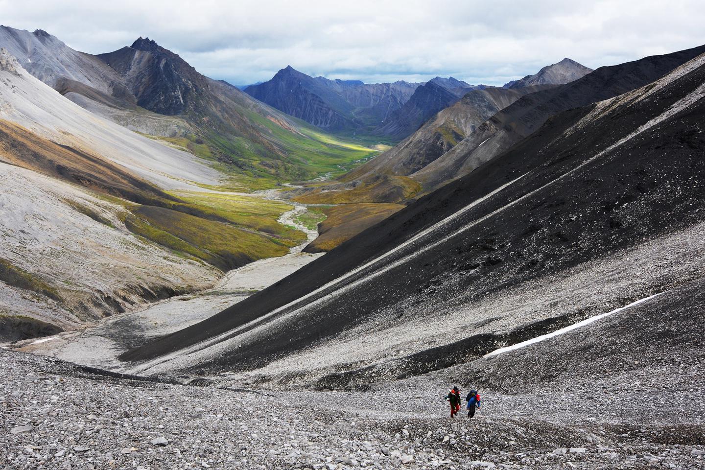 Hikers crossing a mountain passHikers choose river valleys as corridors when hiking over mountain passes.