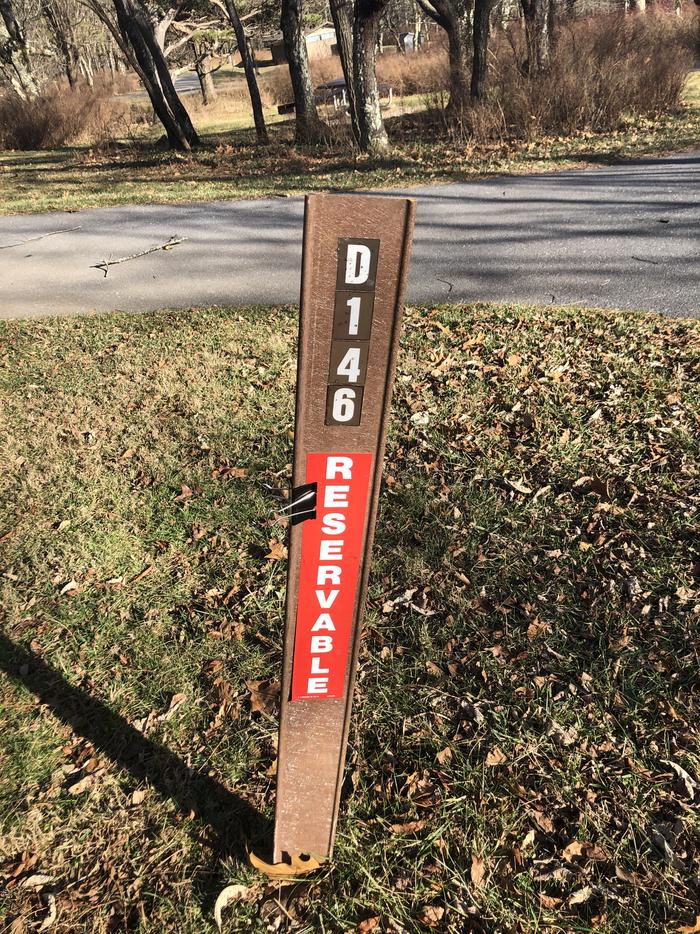 D146 Site marker: If you reserve this site, your camping pass will be attached to this marker.  When you check out, drop your pass at the registration office.