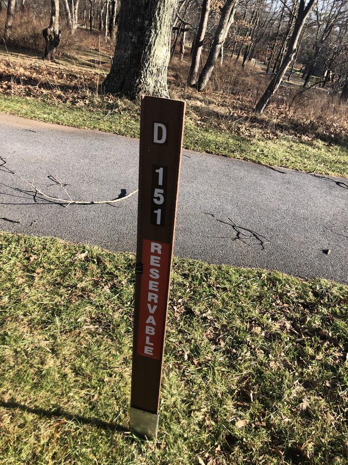 D151site marker;If you reserve this site, your camping pass will be attached to this marker.  When you check out, drop your pass at the registration office. If you reserve this site, your camping pass will be attached to this marker.  When you check out, drop your pass at the registration office.