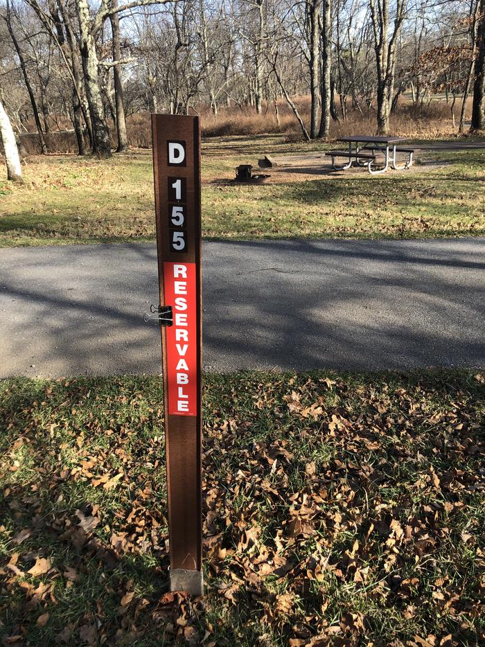 D155 site marker; If you reserve this site, your camping pass will be attached to this marker.  When you check out, drop your pass at the registration office.
