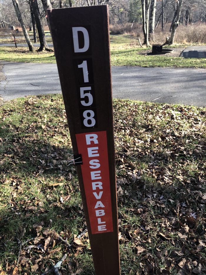 D158 site marker; If you reserve this site, your camping pass will be attached to this marker.  When you check out, drop your pass at the registration office.