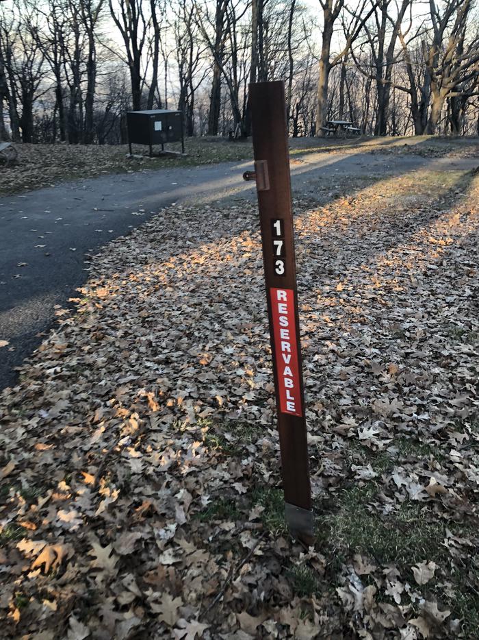 Site marker for E173: If you reserve this site, your camping pass will be attached to this marker.  When you check out drop your camping pass at the registration office.