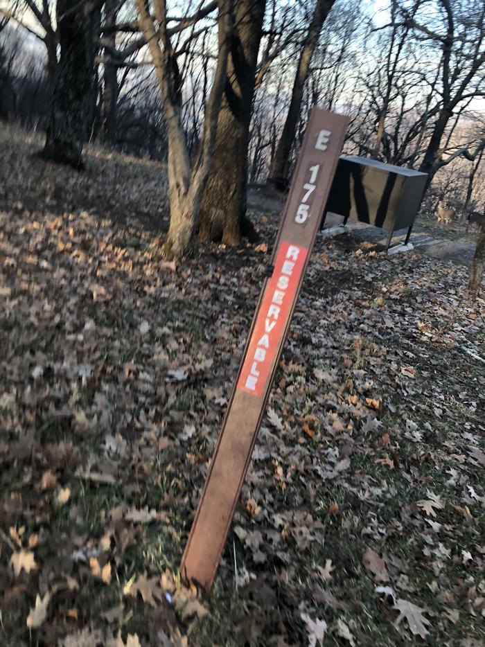 Site marker for Campsite E175; If you reserve this site, your camping pass will be attached to this marker.  When you check out drop your camping pass at the registration office.