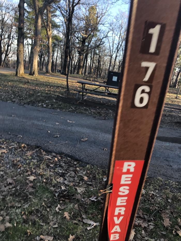 Site marker for Campsite E176;If you reserve this site, your camping pass will be attached to this marker.  When you check out drop your camping pass at the registration office. 