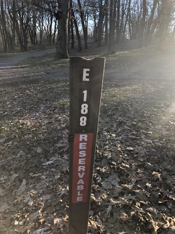 Site marker for Campsite E188; If you reserve this site, your camping pass will be attached to this maker.  When you check out drop your camping pass at the registration office.
