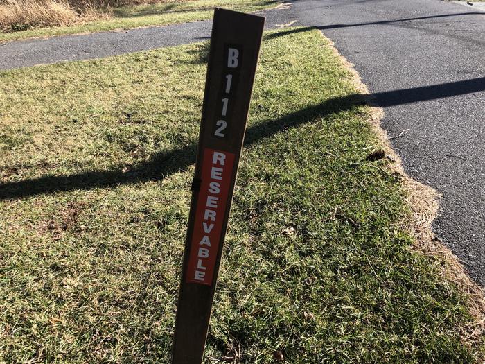 Site marker for B112; If you reserve this site, your camping pass will be attached to this site marker.  When you check out, drop your pass off at the registration office. 