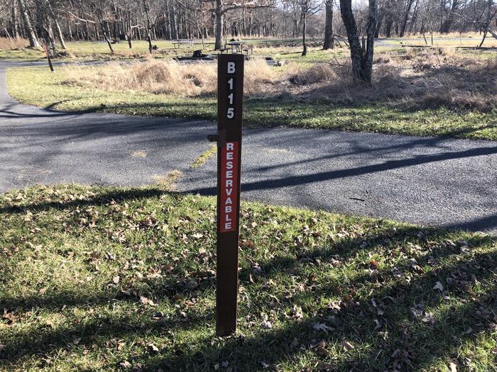 Site marker for B115; If you reserve this site, your camping pass will be attached to this site marker.  When you check out, drop your pass off at the registration office. 