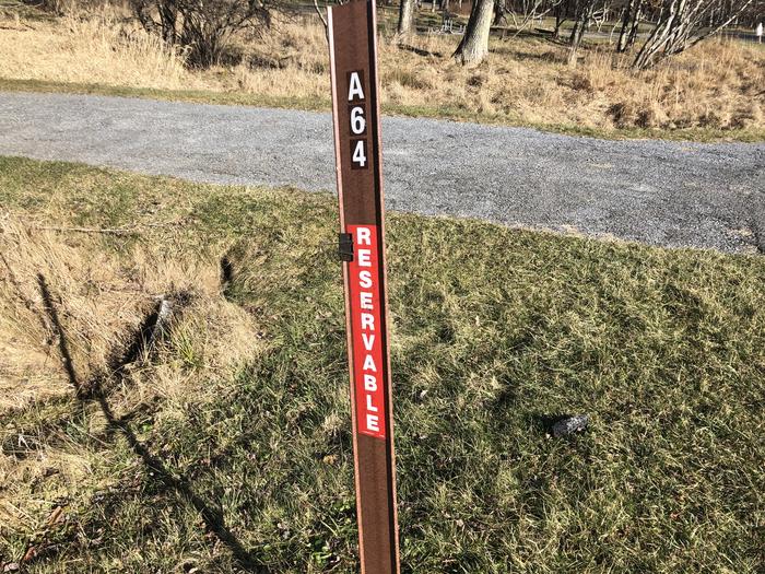 Site marker for A64; If you reserve this site, your camping pass will be attached to this site marker.  When you check out, drop your pass off at the registration office.