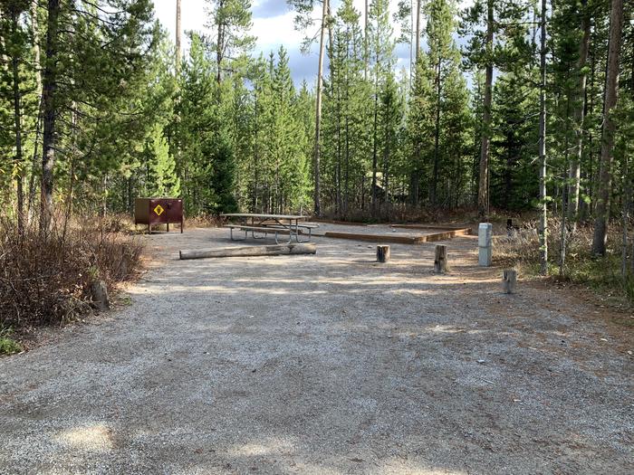 A photo of Site 18 of Loop 1 at Signal Mountain Lodge Campground with Picnic Table, Electricity Hookup, Fire Pit, Shade, Food Storage, Tent PadADA Accessible. 
