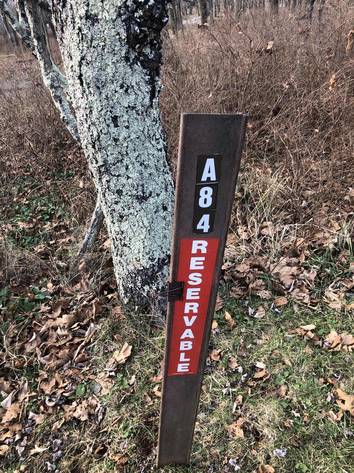 Site marker for A84; If you reserve this site, your camping pass will be attached to this site marker.  When you check out, drop your pass off at the registration office. 