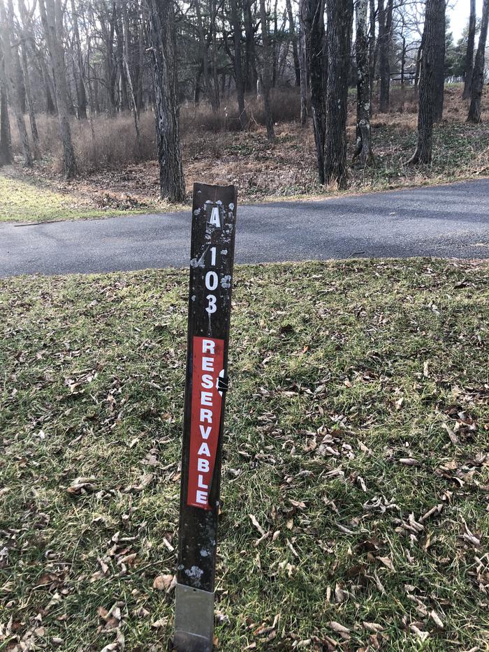 Site marker for A103; If you reserve this site, your camping pass will be attached to this site marker.  When you check out, drop your pass off at the registration office. 