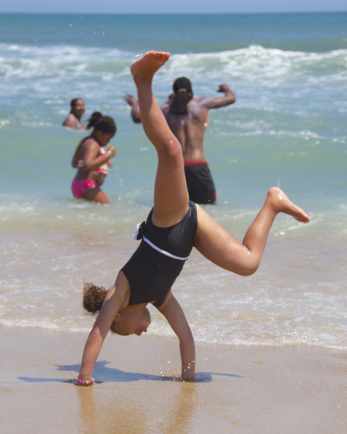 Cartwheel on the BeachGirl enjoys Cape Hatteras by performing a cartwheel.