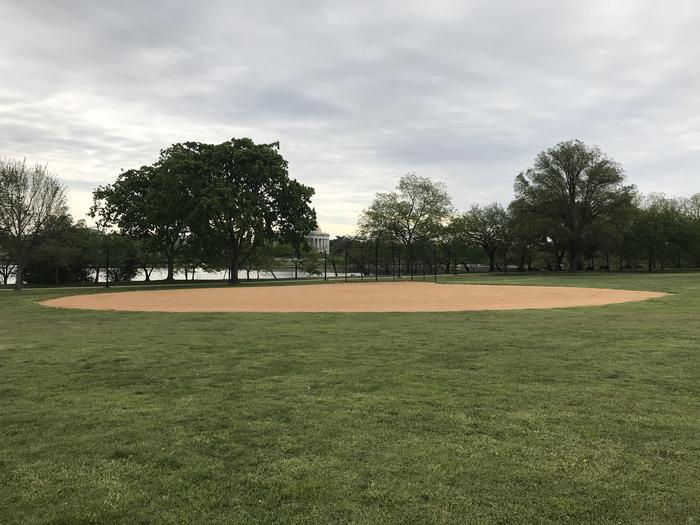 A View of field S1, featuring an an outfield, infield, and backstop, with trees, the Tidal Basin and the Thomas Jefferson Memorial in the background. A View of field S1 with the Tidal Basin and the Thomas Jefferson Memorial in the background. 