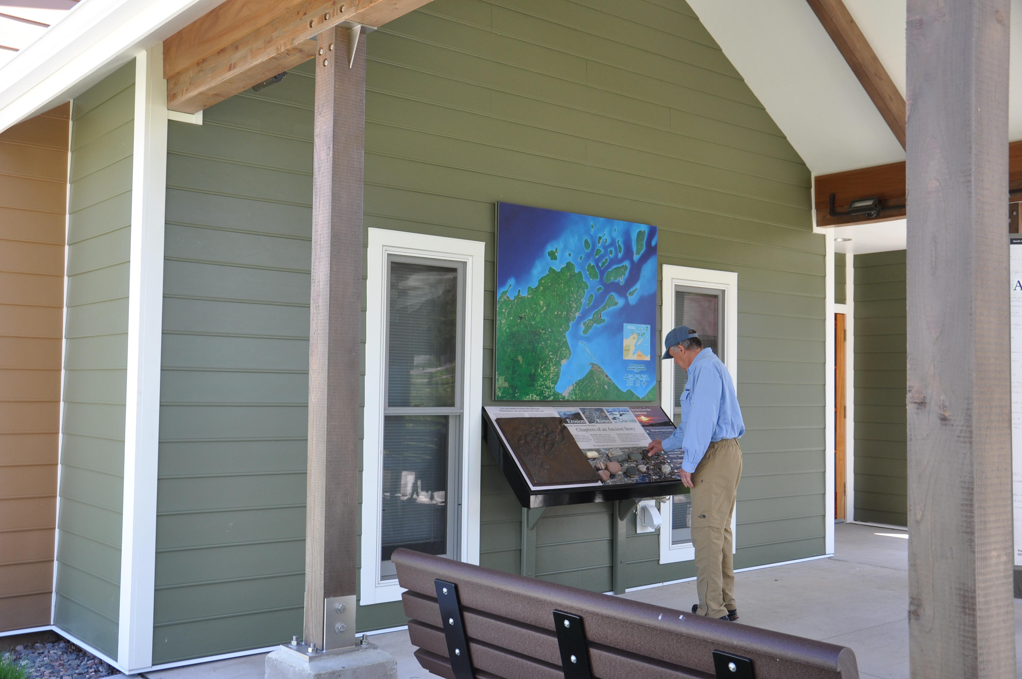 Wall map with touch and audio exhibits under patio.