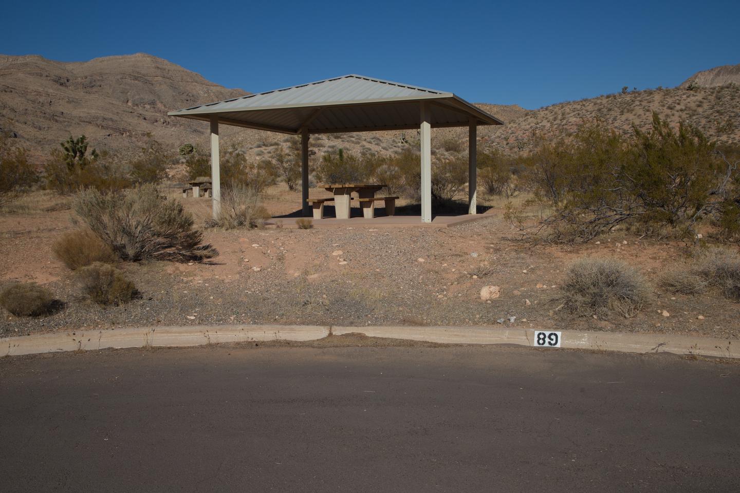 Site 89Site 89 - Site has shade structure, fire pit, plenty of flat tent spots, and a large RV parking. The site has slight slope to reach shade structure.