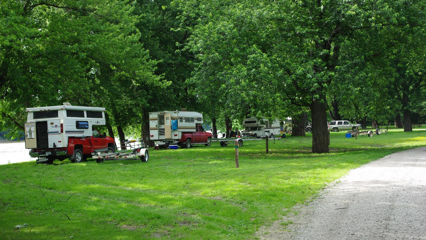 Pickup Truck Campers along river campsites