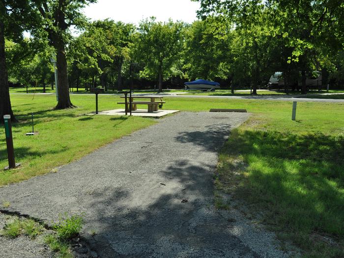 Site 32 - Blue Bill PointSite 32 offers an asphalt drive and partial shade.