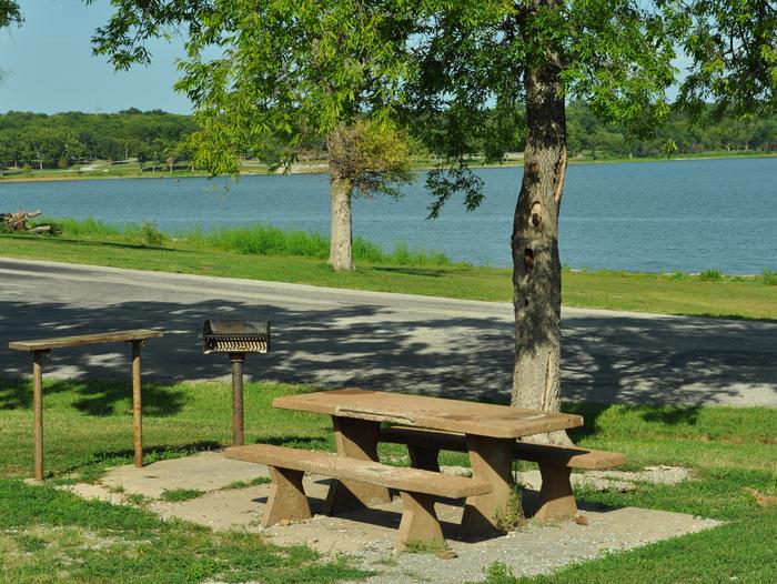 Blue Bill Point - Site 34Site 34 offers a concrete picnic table, pedestal grill, utility table.  It offers easy access to the shoreline for bank fishing or to moor vessels.