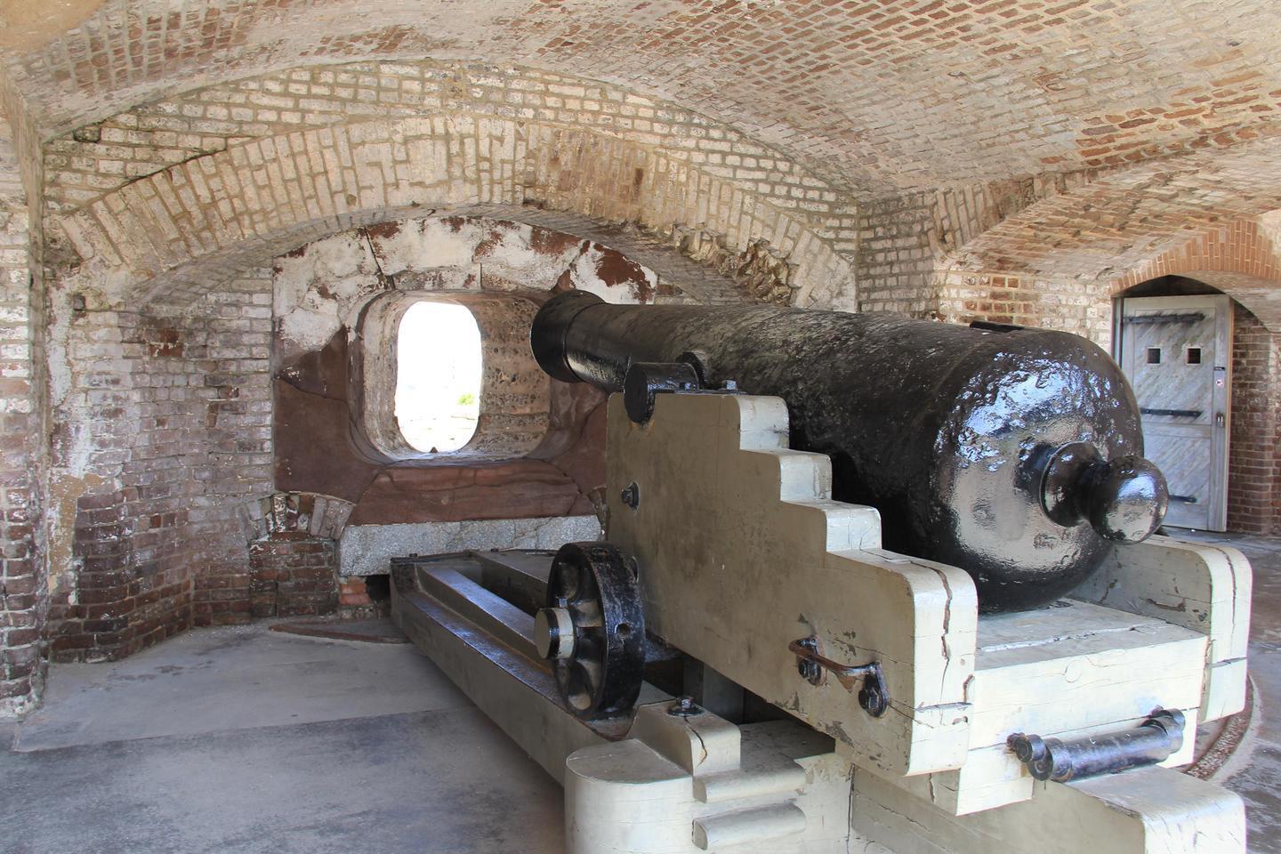 Fort Sumter CannonFort Sumter cannon sitting on cannon carriage under a brick casemate