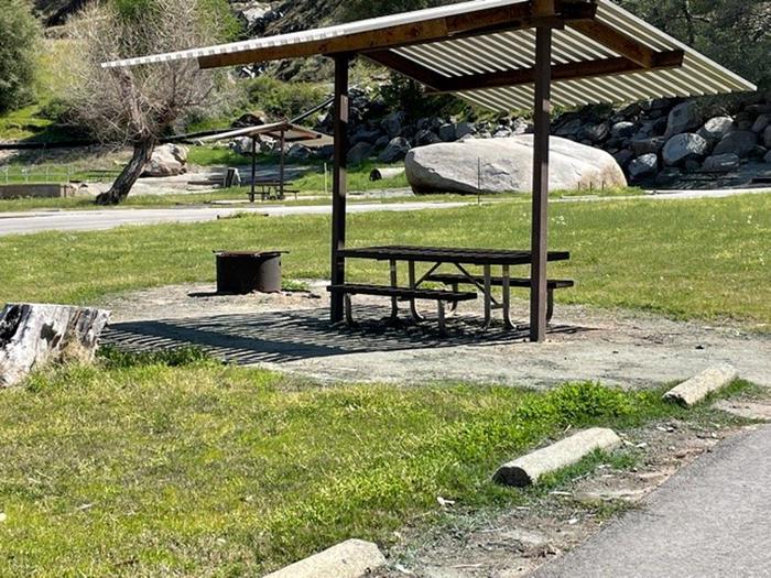 Site areaShade shelter, picnic table, and fire ring.