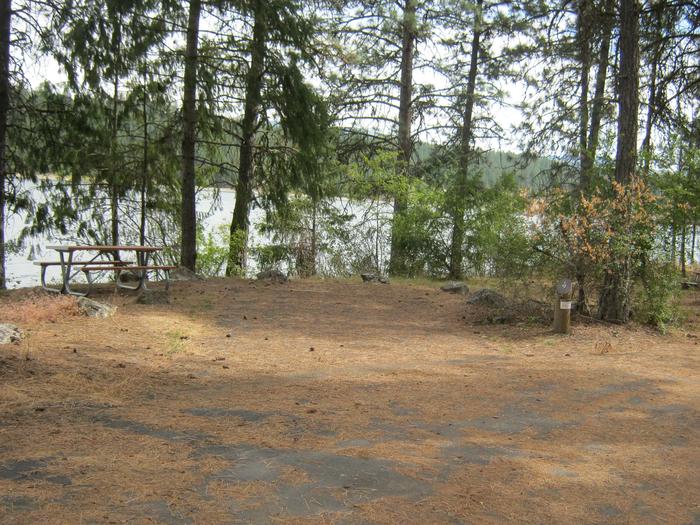 Site 9. Back in with trees and lake in the background.