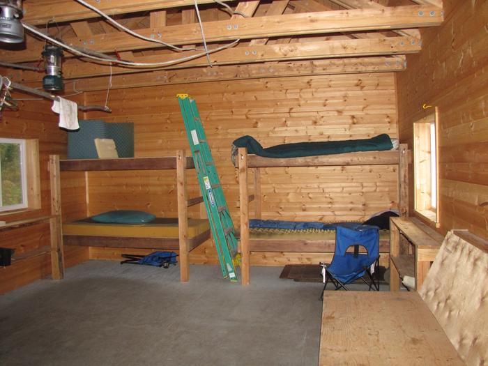 view of bunks and bench inside Esker Stream Cabin (Wrangell-St Elias)