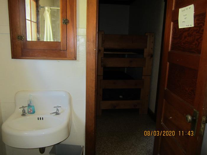 A bathroom sink across from the bunk beds.Barber Flat's restroom is conveniently close to the bunk bedroom.