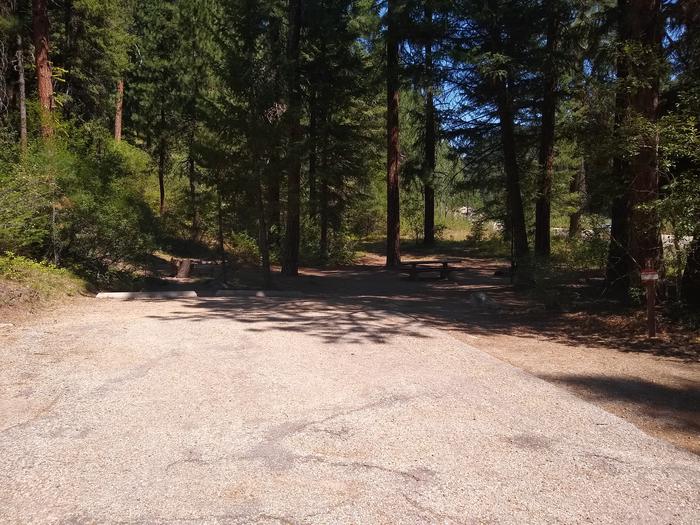 A long, wide paved driveway leading to a single campsite.Site 1 at Bad Bear Campground has a long, wide driveway.