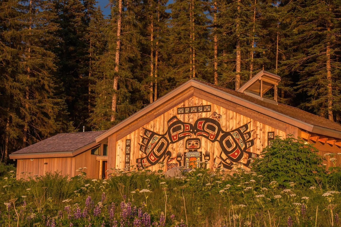 The Huna Tribal House at SunsetGolden sunlight strikes the front of the Huna Tribal House