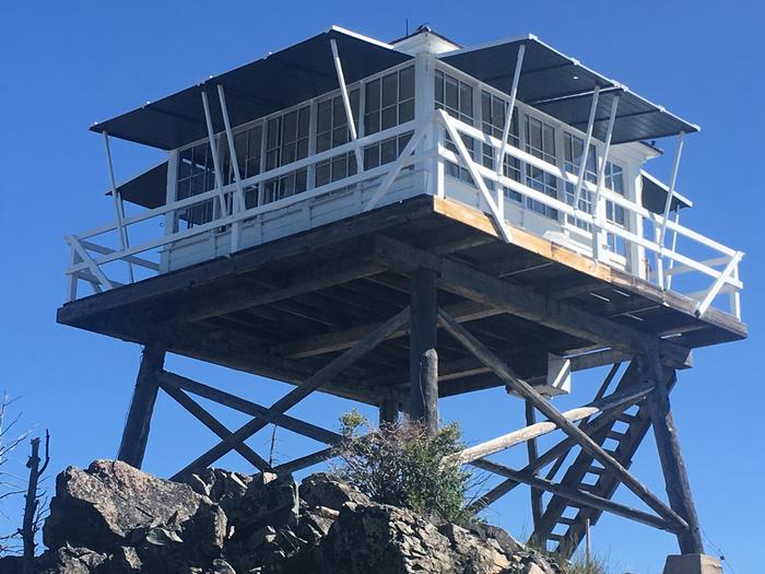 Medicine Point Lookout outside close upA fire lookout sets on top a mountain