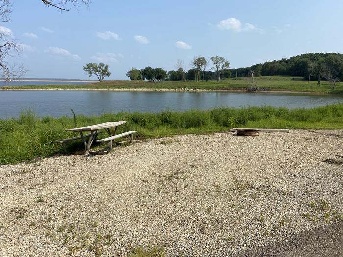 A photo of Site PA03 of Loop PENA at ROCK CREEK (KS) with Picnic Table, Fire Pit, Waterfront