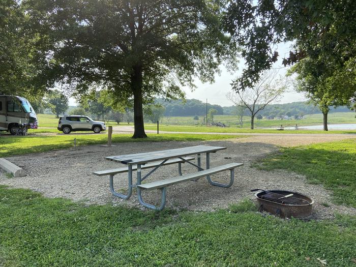 A photo of Site PB47 of Loop PENB at ROCK CREEK (KS) with Picnic Table, Electricity Hookup, Fire Pit, Shade, Water Hookup
