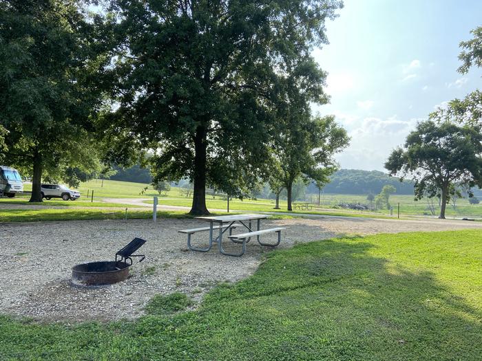 A photo of Site PB48 of Loop PENB at ROCK CREEK (KS) with Picnic Table, Electricity Hookup, Fire Pit, Shade, Waterfront