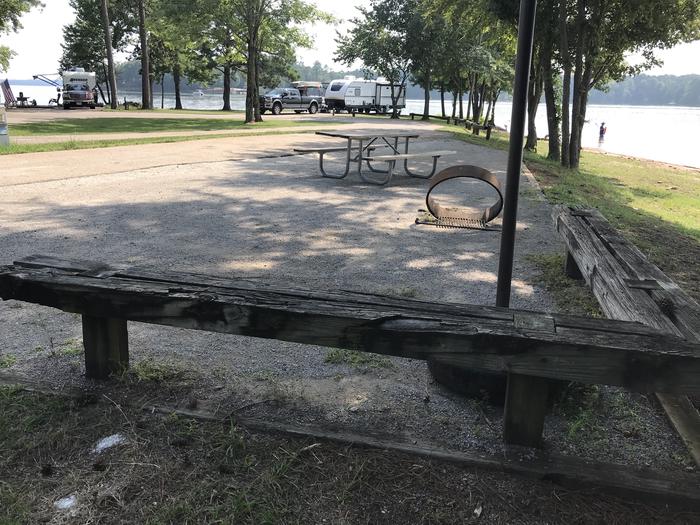 A photo of Site 107 of Loop LOOJ at Holiday (Georgia) with Picnic Table, Electricity Hookup, Fire Pit, Waterfront, Lantern Pole, Water Hookup