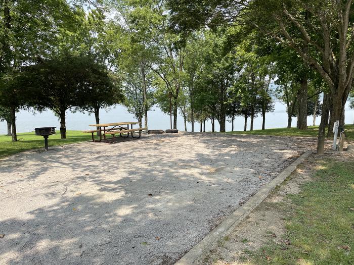 A photo of Site 039 of Loop LAKE at DEFEATED CREEK PARK with Picnic Table, Fire Pit, Shade, Full Hookup, Waterfront, Lantern Pole